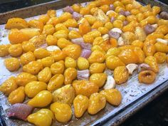 there are many different types of food on the trays that is ready to be cooked