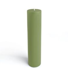 a green pillar candle on a white background