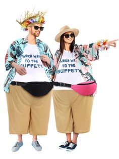 two people dressed in funny outfits and hats, one pointing at the camera while the other points