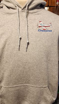 PLEASE NOTE: If ordered after 12/6/2023 item may not arrive before Christmas. Pull over Hoodie with an airplane embroidered on the left chest. It can be embroidered with or without the N#. Please enquire about other color schemes and aircraft model designs. Content: 50% Cotton & 50% Polyester Care: Machine Wash, Cold; Do Not Bleach; Tumble Dry, Low; Do Not Iron; Do Not Dry Clean. Please visit my shop for more custom items. https://jkhandcrafts.etsy.com Casual Hoodie With Embroidered Patch, Pull Over Hoodie, Airplane Design, Pilot Gifts, Embroidered Gifts, Personalized Hoodies, Embroidered Hoodie, Embroidered Sweatshirts, Beautiful Embroidery