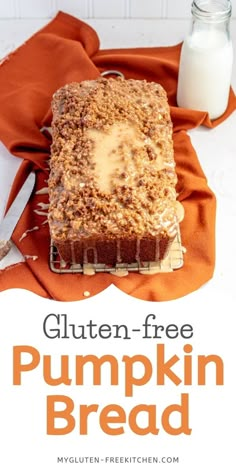 gluten - free pumpkin bread on a cooling rack next to a glass of milk