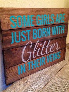 a wooden sign that says some girls are just born with glitter in their veines