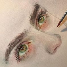 a pencil drawing of two eyes with one being drawn