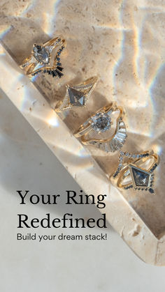 four rings sitting on top of a marble slab with the words, your ring redefried build your dream stack