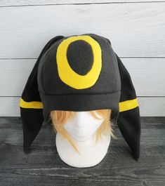 These hats are made from fleece and interfacing in the ears but still have floppiness to them and do not stand up (sorry but I do not offer this option). ⫸ Perfect for: fans, cold weather, costumes, or conventions. Very warm! ⫸ Size: Fits anyone age 5+, one size fits most. Circumference about 24-25 in. ⫸ Care instructions: I recommend hand wash but should be fine in machine wash cold. All hats are made in a smoke-free, pet-free environment. All hats are made with a sewing machine. Patterns and d Weather Costumes, Shiny Umbreon, Pokemon Hat, Fleece Hats, Fleece Hat, Hat Ideas, Sewing Machine, Cold Weather, Stand Up