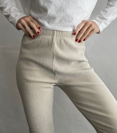 Essential Ultra High Waist Ribbed Leggings in Cream Color. Size L. Fits S/M best. Please refer to measurements below. Made in Korea of 76% Cotton, 12% Polyester and 12% Spandex. Elastic waist. Condition is Beautiful. Shows normal signs of wear.  The colors of the photographs may differ slightly from the actual item colors. Measurements were taken with item laying flat, and are approximate. Waist: 12"-14" Rise: 12" Hips: 18" Inseam: 28 1/4" Length: 38" Please message questions prior to purchase- Fitted Full Length Beige Leggings, Beige Stretch High-cut Legwear, Beige Ribbed Leggings, Beige Fitted Full-length Leggings, High Stretch Ribbed Full-length Leggings, Ribbed Leggings, Outfits With Leggings, Cream Color, Women's Leggings