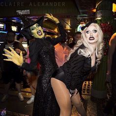 two women dressed up in costumes and posing for the camera