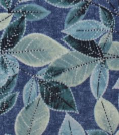 a blue and green leafy pattern on fabric