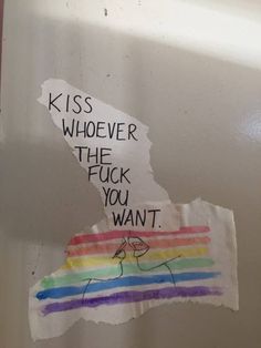 a piece of paper taped to the side of a refrigerator door that says, kiss whoever the fock you want