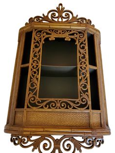 an ornate wooden shelf with glass doors