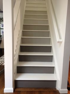 the stairs are painted gray and white