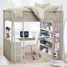 a loft bed with desk underneath it in a room that has white walls and wood floors