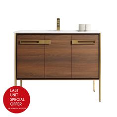 a bathroom vanity with two sinks and a red round sign that says last unit special offer