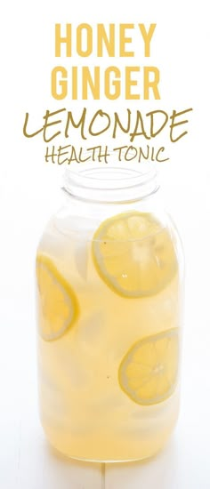 a jar filled with lemonade sitting on top of a table