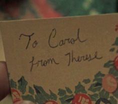 someone is holding up a card with the words to carol from henry written on it