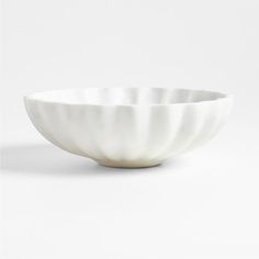 a white bowl sitting on top of a table