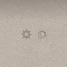 the sun, moon and stars are drawn on paper