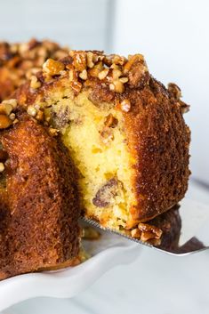 a close up of a piece of cake on a plate with a fork in it