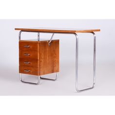 a wooden desk with two drawers on each side and a metal frame around the top