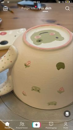 a close up of a cake on a plate with an elephant design and polka dots