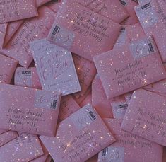 pink glitter business cards are scattered on top of each other, with the wording