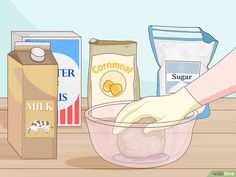 a person mixing ingredients in a bowl on a wooden table with milk, butter and sugar