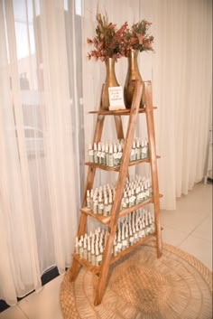 a wooden ladder with bottles on top of it