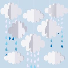 several clouds with raindrops hanging from them on a blue background, one is raining