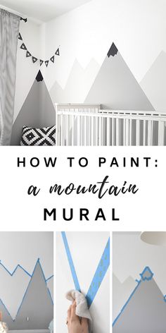 a baby's room with mountains painted on the wall and blue tape around it