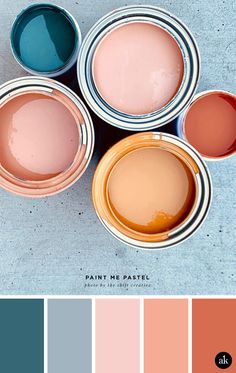 four paint cans with different shades of pink, blue and orange in them on top of each other