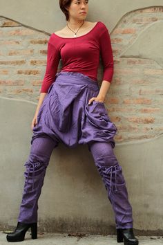 Baggy Purple Bottoms For Fall, Purple Baggy Pants For Fall, Baggy Harem Pants With Side Pockets, Spring Harem Parachute Pants With Pockets, Harem Bottoms With Pockets For Fall, Fall Harem Pants With Pockets, Fall Harem Bottoms With Pockets, Baggy Parachute Pants With Pockets For Festivals, Fall Drop Crotch Harem Pants With Pockets