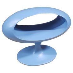 a blue object sitting on top of a white surface