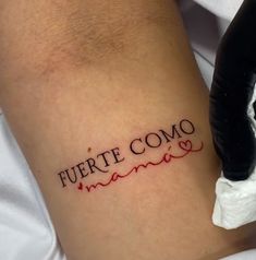 a tattoo that reads fuerte como mama