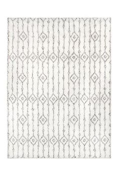 a white and grey rug with an intricate design on the bottom, in front of a white background