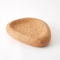 The Nuclia Cork Bowl is a versatile and stylish addition to your home decor. Crafted from cork, a natural material with unique character and coloring, this bowl serves as the perfect catchall or a place to showcase your cherished treasures. Dimensions Overall 15"L x 12"W x 3"H (3.7 lbs)  Dust with dry cloth Product is not Food Safe Brown Cork Slides With Cork-bed Midsoles, Cork Bowl, Burl Wood Bowls, Cork Clutch, Cork Yoga Mat, Global Views, Natural Material, Soup Bowl, Food Safe