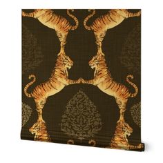 a wall hanging with two tigers on it's sides and an ornate pattern in the background