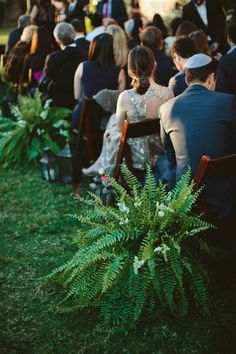 a group of people that are sitting in chairs