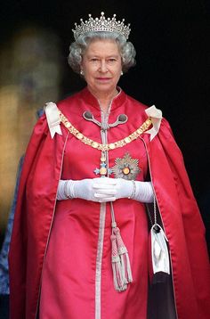 the queen of england is dressed in red