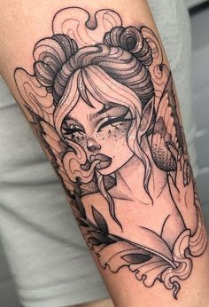 a woman's arm with tattoos on it