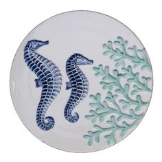 Ceramic plate has a navy seahorse and coral designs. Measures 7.375 x 7.375 x 0.25. Dishwasher safe. 89-3589 Ceramic Seahorse, Ocean Kitchen, Mermaid Tails For Kids, Ceramic Trivet, Coastal Beach House, Beach House Kitchens, Teal Coral, Coral Design, Cottage By The Sea