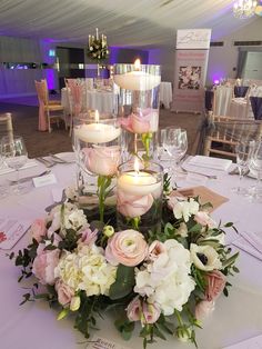 the centerpieces are decorated with candles and flowers