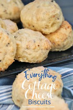 everything cottage cheese biscuits on a black plate with blue and white checkered napkins