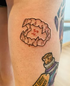 a woman's leg with a tattoo on it that reads, donuts and ketchup