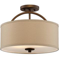 a light fixture with a beige shade on the drum and an iron frame around it