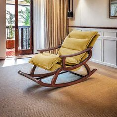 a rocking chair in the middle of a living room