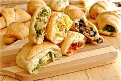 several different types of pastries on a cutting board