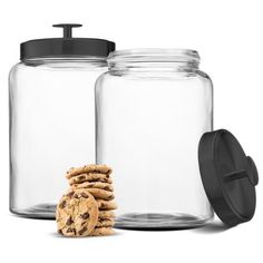 two glass jars filled with cookies next to each other