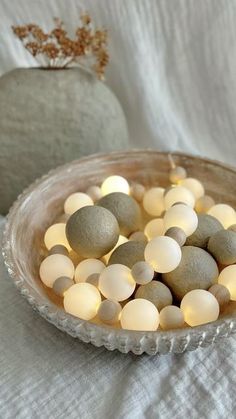 some rocks in a bowl on a table