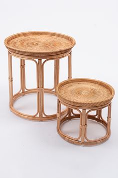 two wicker tables sitting on top of each other