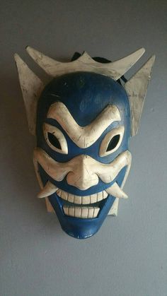 a mask is hanging on the wall